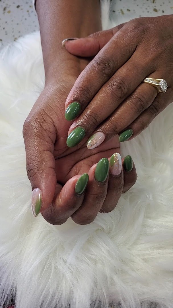 Manicured nails displayed on a salon table.